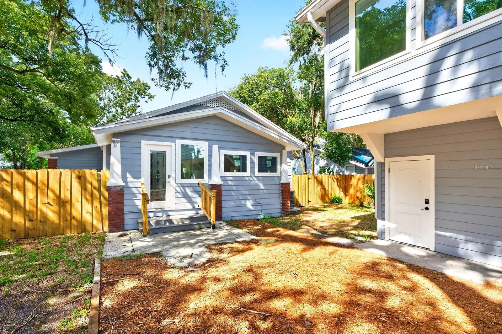 A nearby Mud Room provides convenient access to the FENCED YARD and the detached TWO-CAR GARAGE.