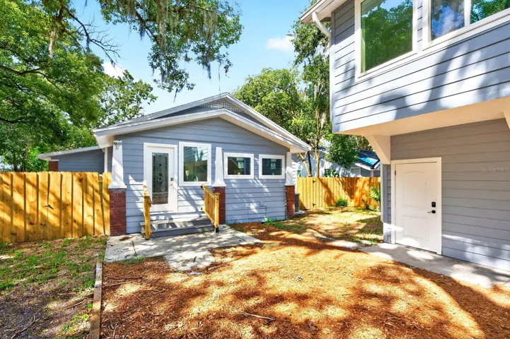 A nearby Mud Room provides convenient access to the FENCED YARD and the detached TWO-CAR GARAGE.