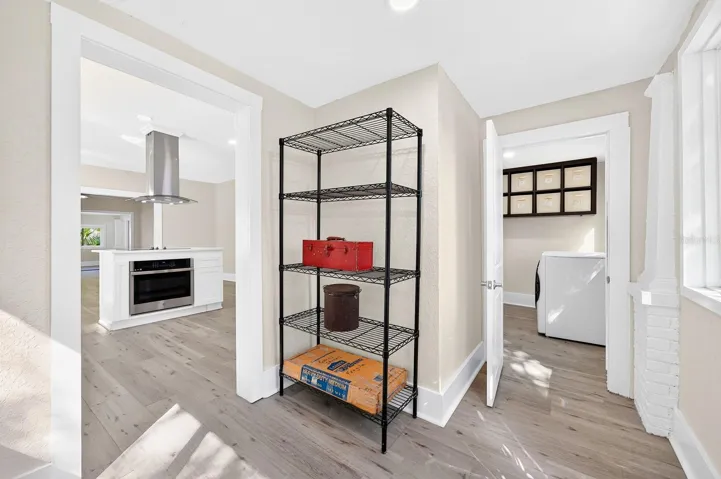 A nearby Mud Room provides convenient access to the FENCED YARD and the detached TWO-CAR GARAGE.