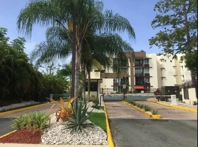 Gated vehicle entrance to the Portal de Sofia condominium community.