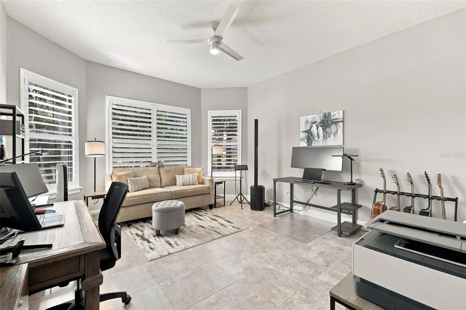 Large front Bedroom with bay window being used as an office and music room