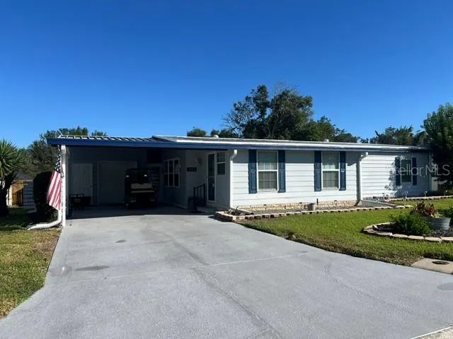 Larger Carport with view of Storage area at back of carport