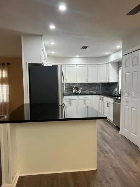 Remodeled Kitchen with Breakfast Bar, Pantry on right