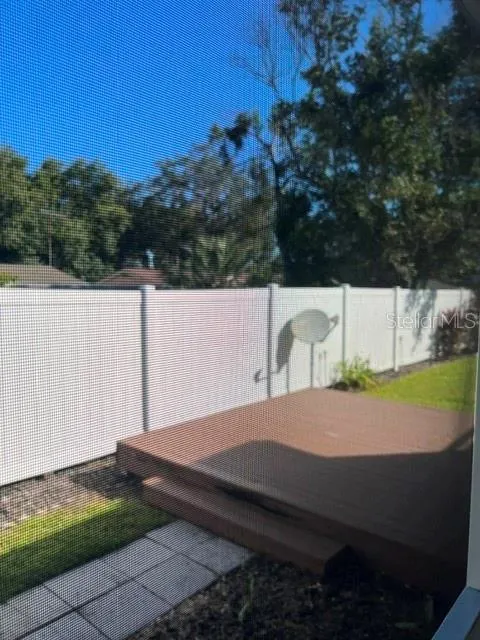 Open deck at back of property and Vinyl fencing