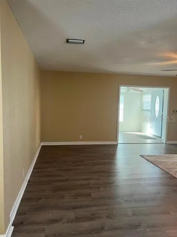 View of Living Room into Florida Room and Entryway