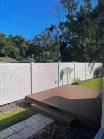 Open deck at back of property and Vinyl fencing