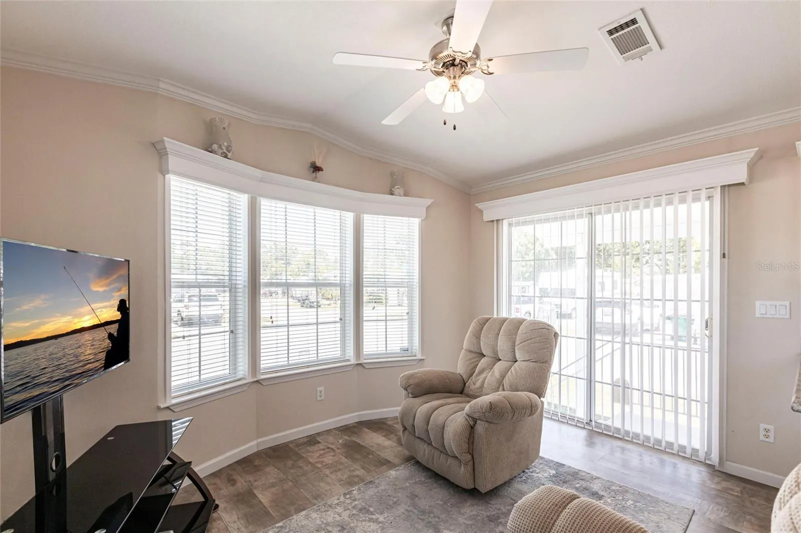 Living area and sliding door to covered patio