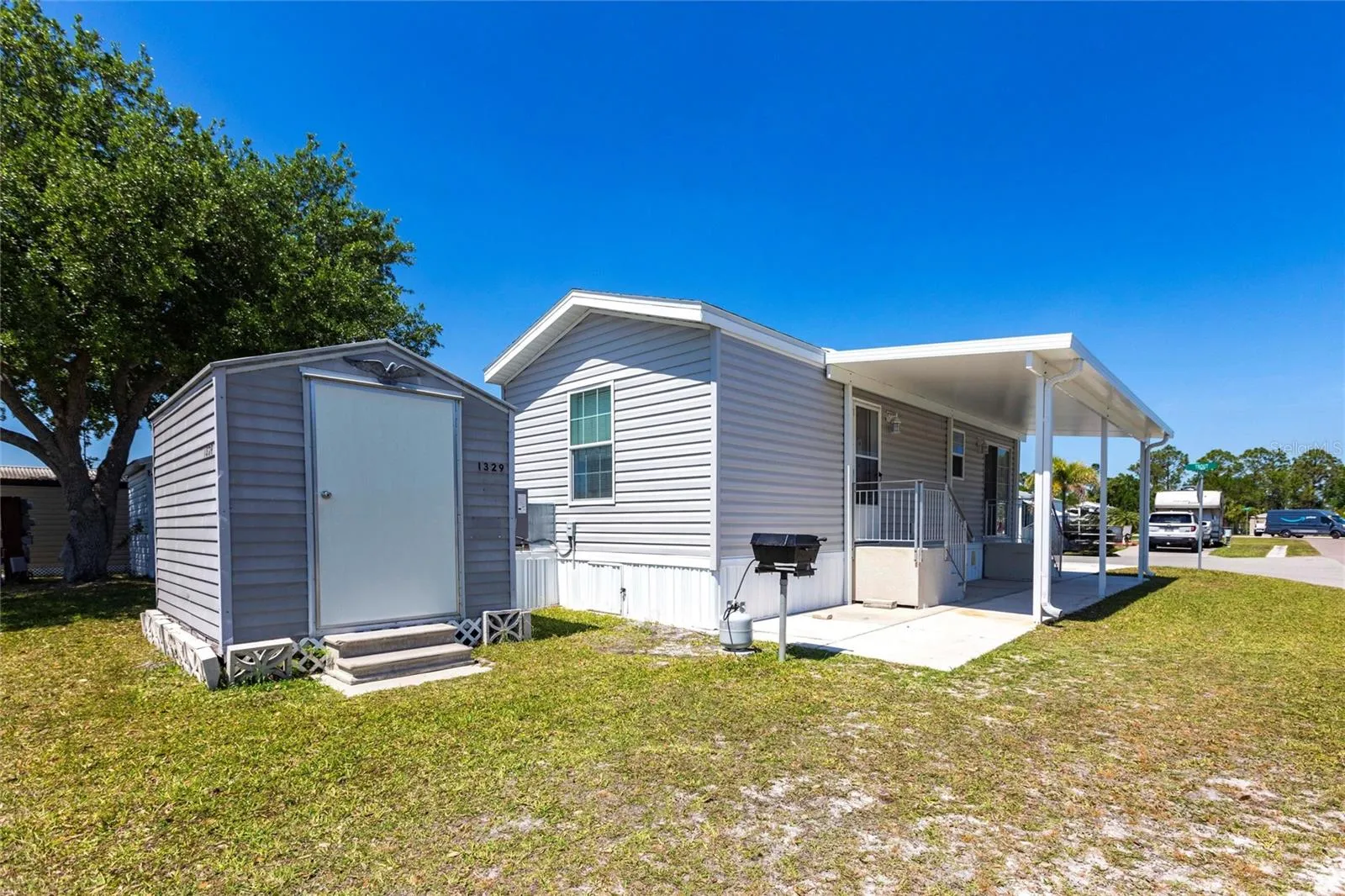 Side of home with shed and bbq