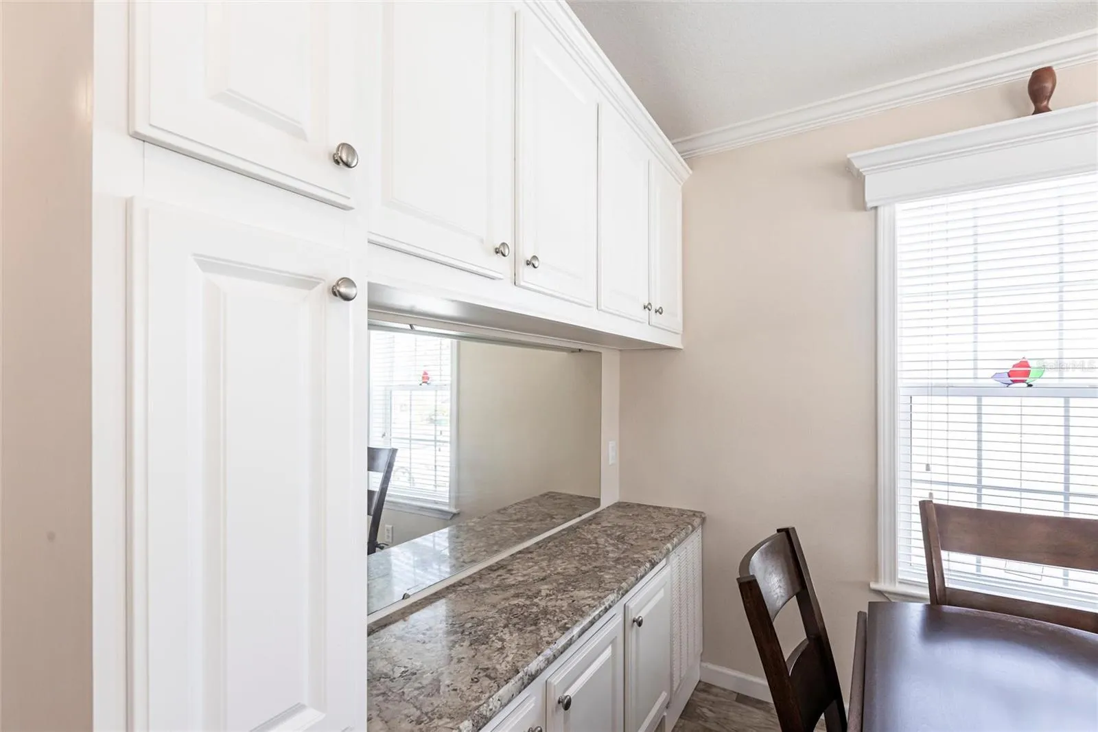 Added cabinets dry bar area
