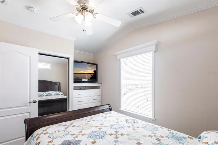 Bedroom built in dresser and sliding closet doors