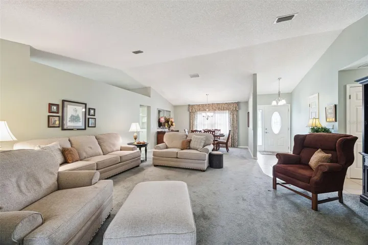 Living and dining room, foyer with coat closet