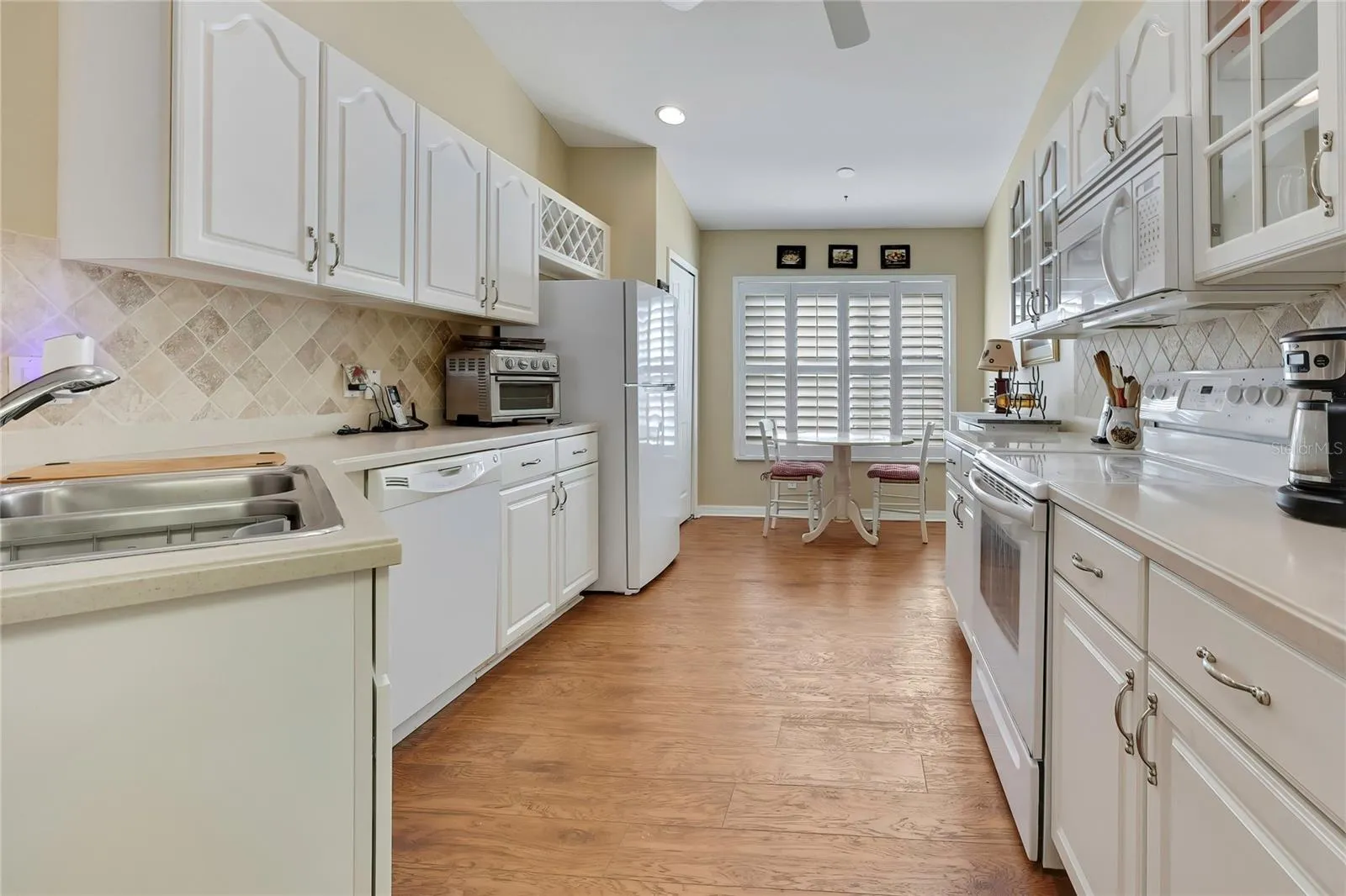Wood and Glass Cabinets, Corian Counters