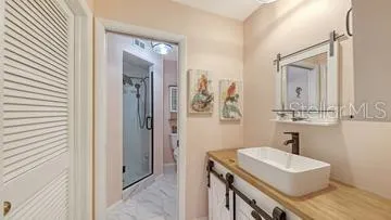 Primary Bathroom and a Walk-In-Closet to the Left