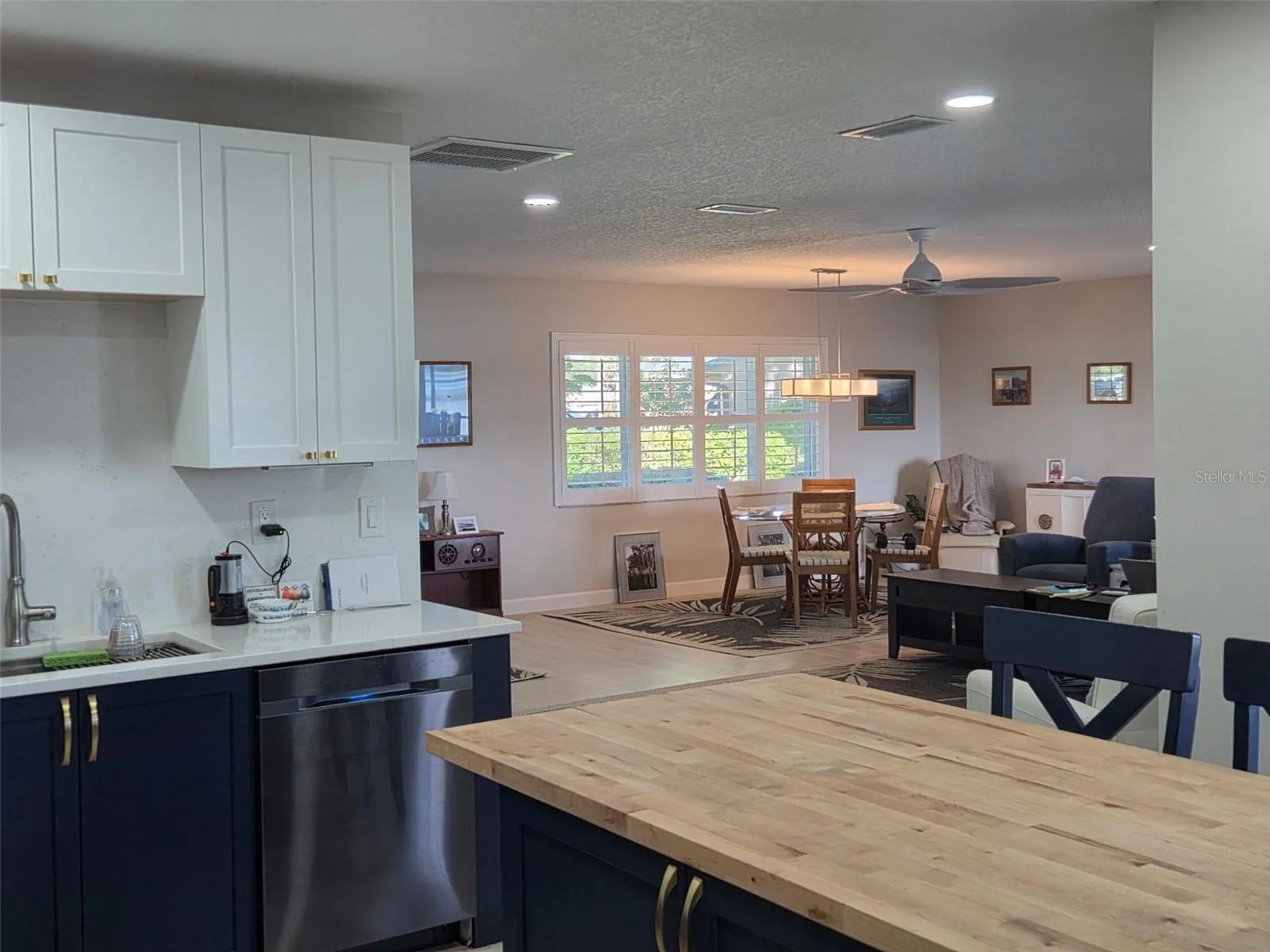 View of the great room and dining room from the kitchen