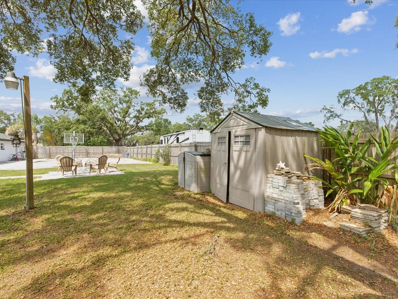 Backyard Storage and Fire Pit Seating Area