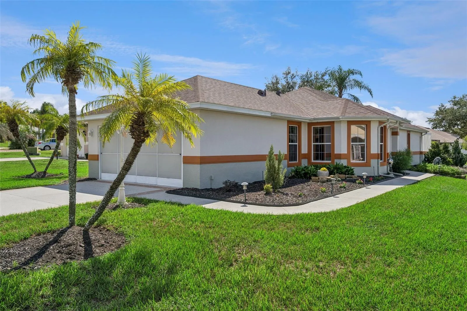 The Front faces Seven Seas Dr, with the driveway entrance from Canoe Ct.