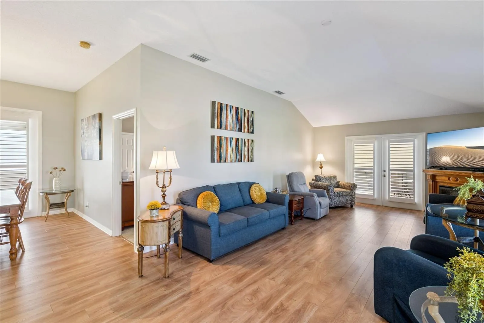 Vaulted Living Room with French doors to the larger screened lanai.
