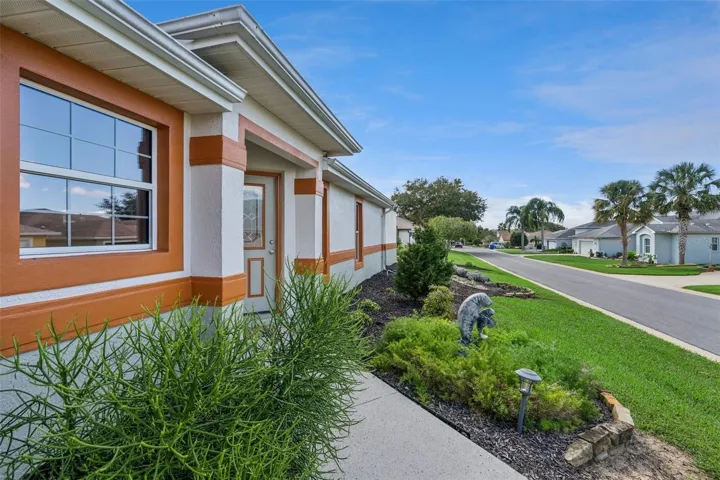 Landscaped beds frame the front entry.