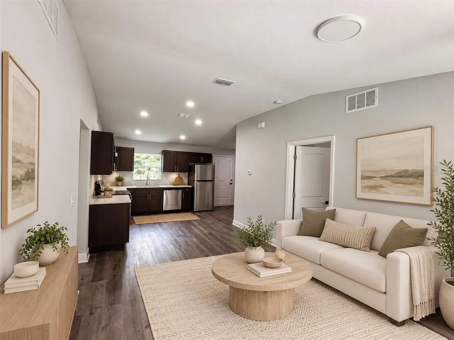 Virtually staged living area and kitchen