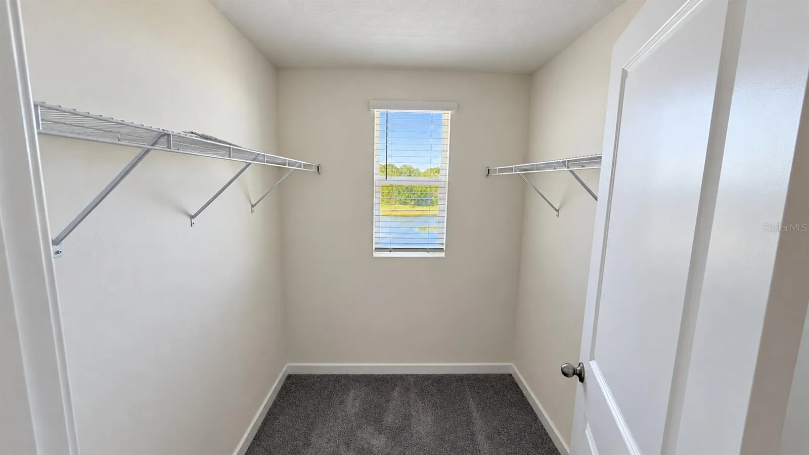 Walk-in closet - empty; no virtual staging.