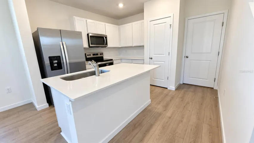 Kitchen - unfurnished; no virtual staging.