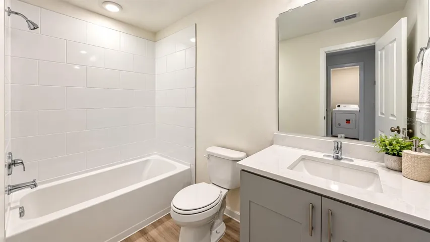 Bathroom - tub and vanity; virtually staged decor.