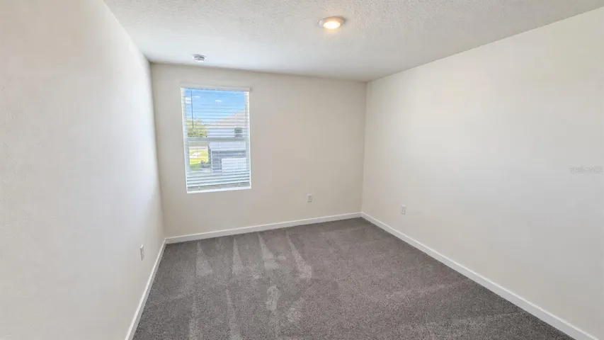 Bedroom 2 - unfurnished; no virtual staging.