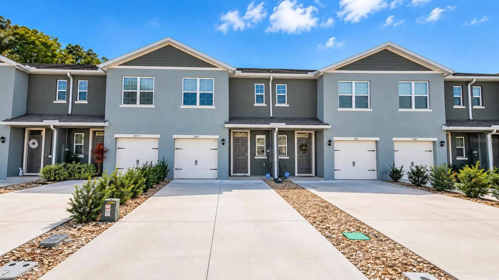 Front exterior and attached garage.