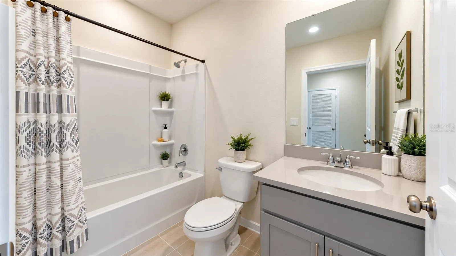 Bathroom with tub, shower and vanity - virtually staged decor.