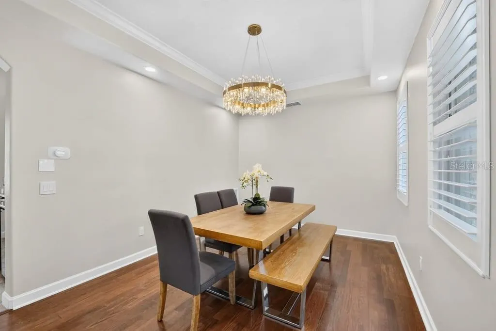 Dining Room features: Plantation Shutters Engineered hardwood flooring