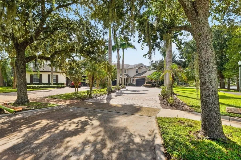 Oversized pavered driveway and split 3- car garage