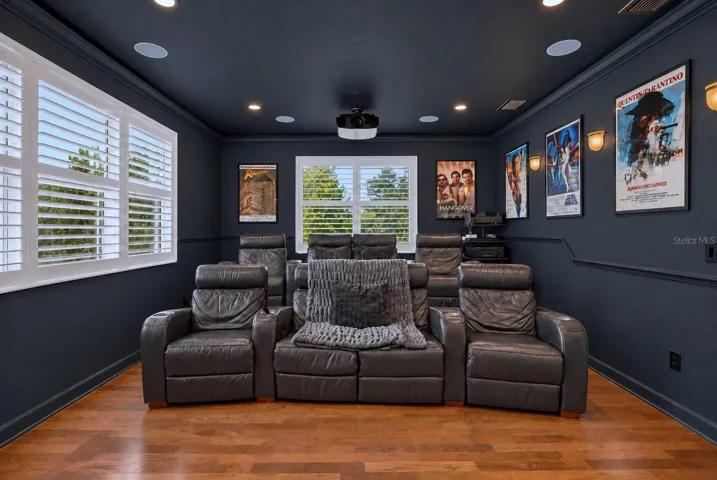 LED-lit crown molding, hidden wall speakers, and light-controlled paint create a true cinema experience!