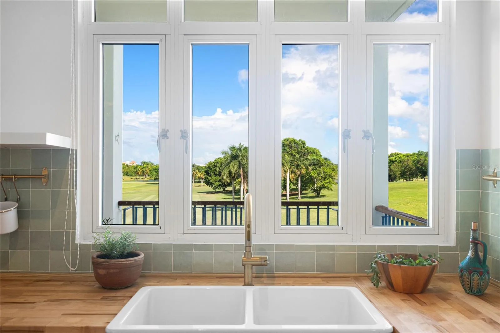 Naturally sunlit kitchen with a view of the golf course Naturally sunlit kitchen with a view of the golf course