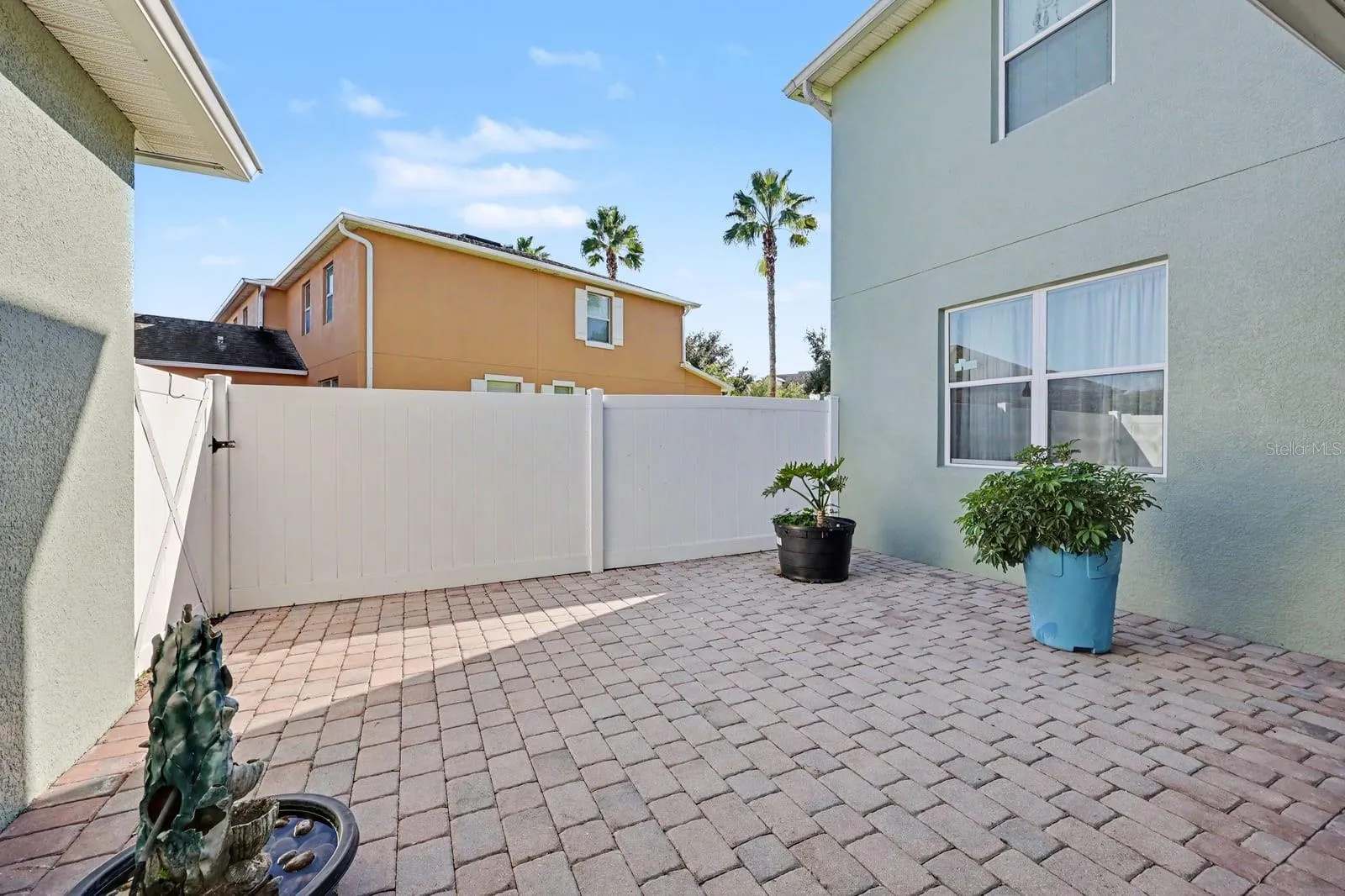 Expansive Patio with Pavers and Private Gated Entry