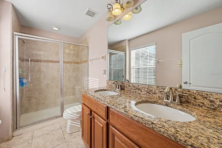 Spa-like Master Bath with Dual Vanities, Granite Countertops &amp; Spacious Walk-In Shower