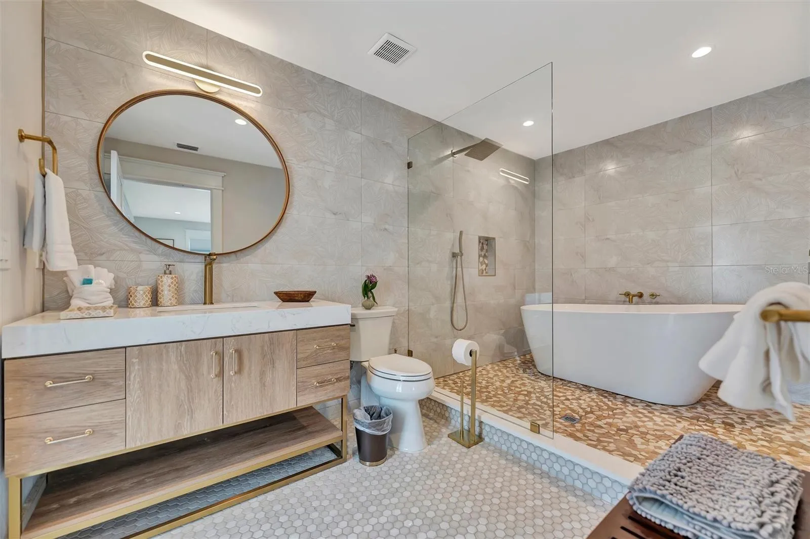 Updated bathroom with freestanding tub and separate shower.