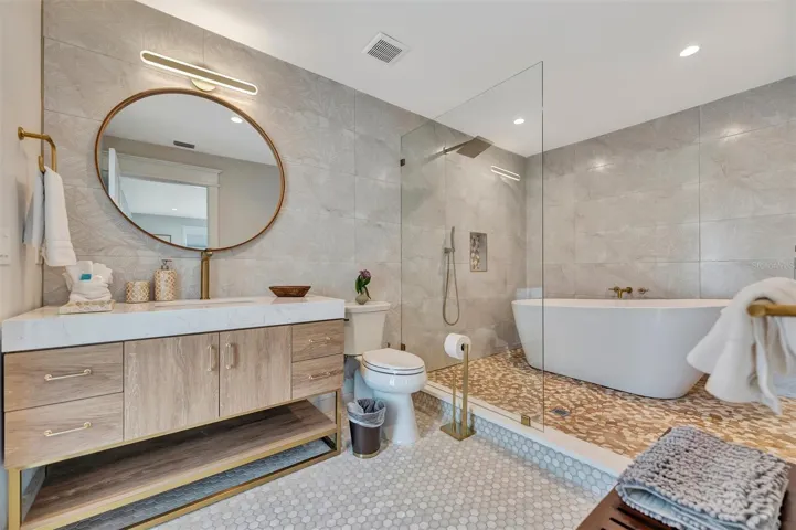 Updated bathroom with freestanding tub and separate shower.
