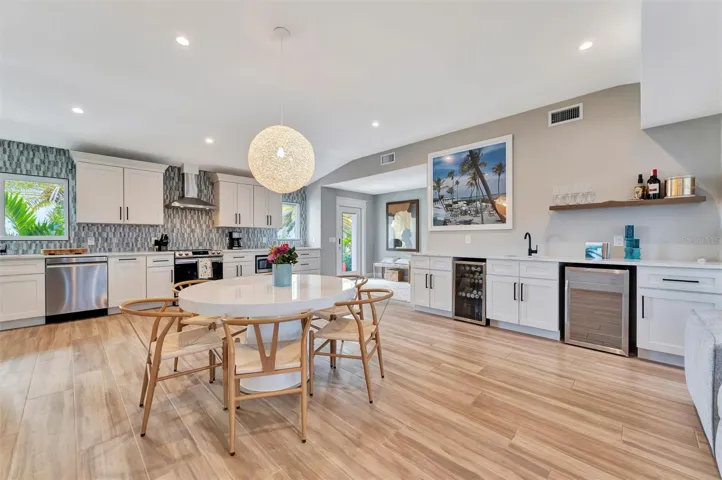 Chef-inspired kitchen with quality appliances, wine and beverage refrigerators, and wet bar.