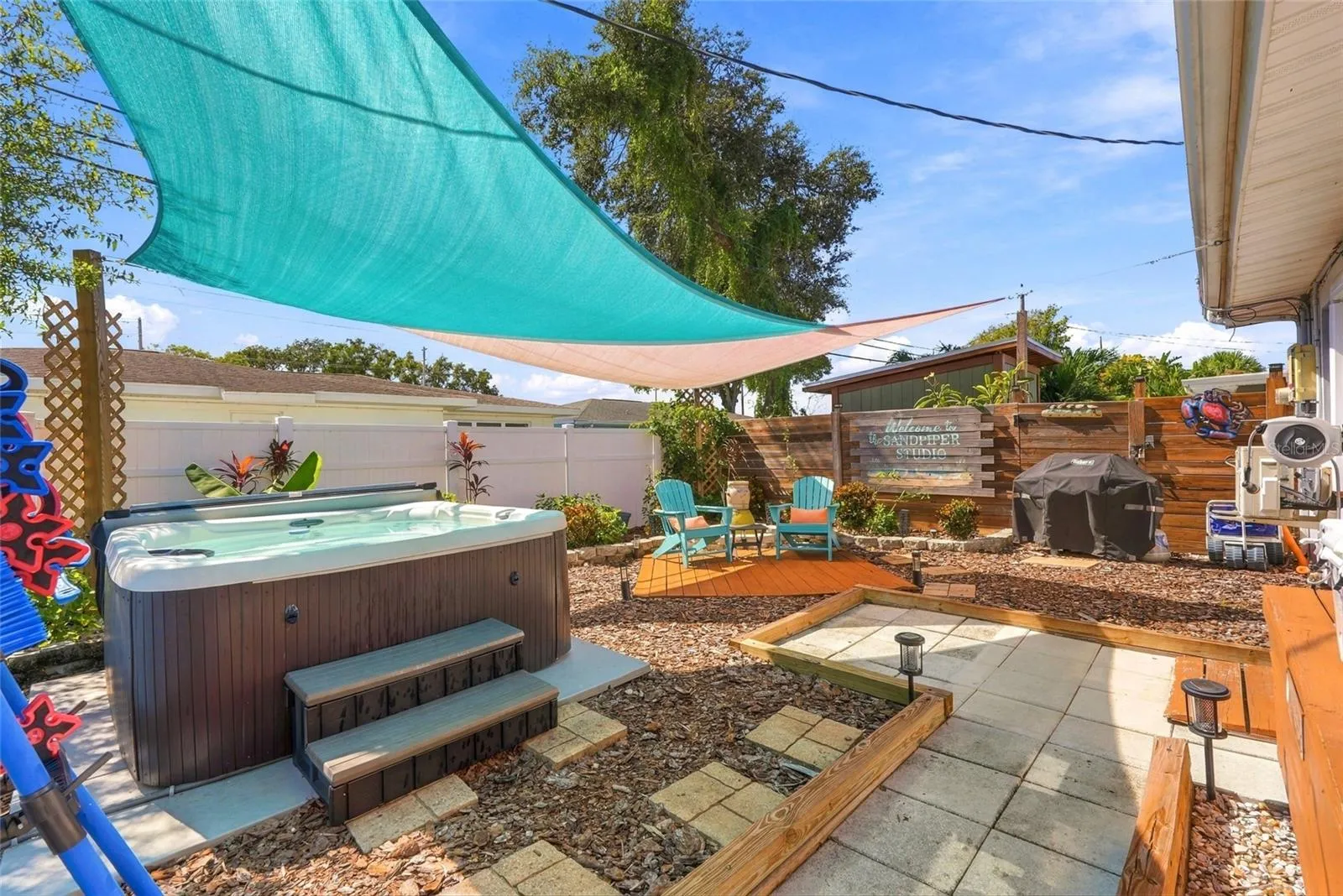 In-law courtyard with hot tub.