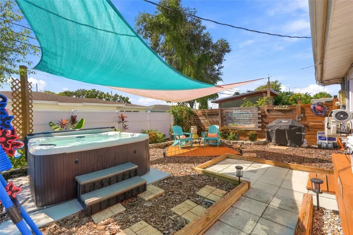 In-law courtyard with hot tub.
