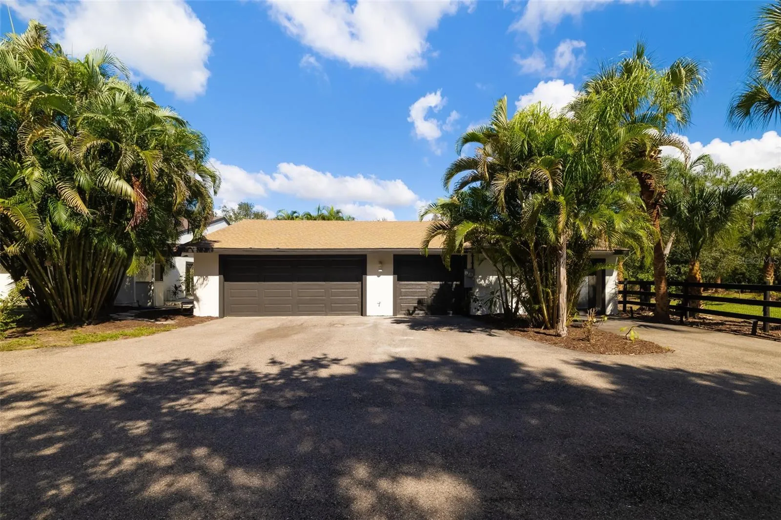 CAR ENTHUSIASTS TAKE NOTE—this substantial extended three-car garage provides exceptional space for vehicles, storage, tools, hobbies and more.