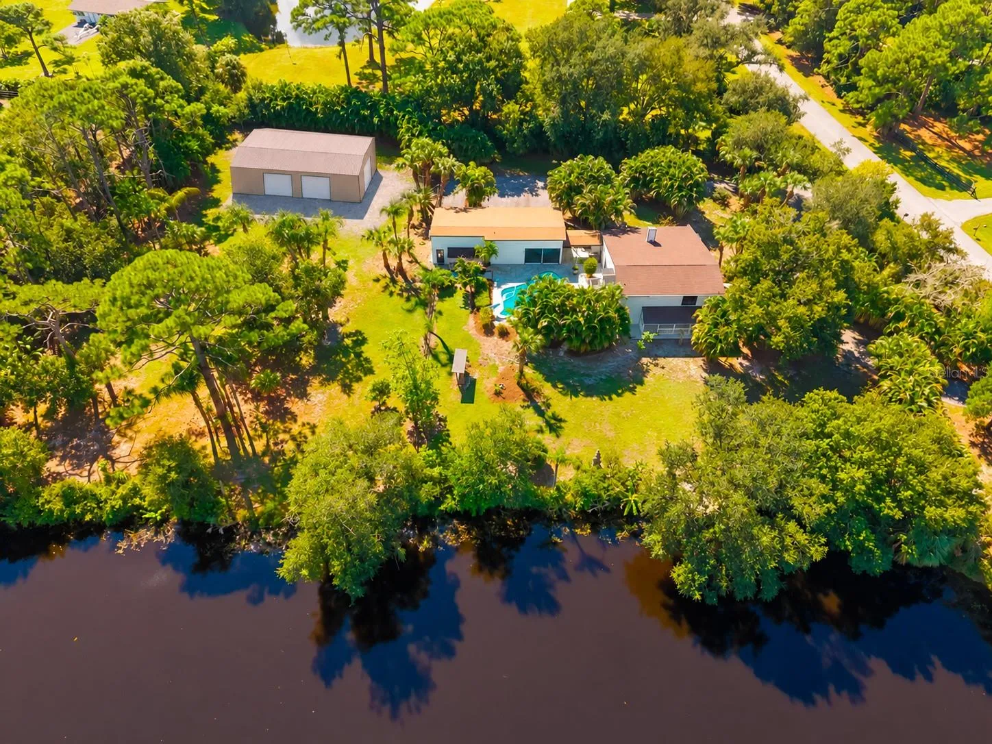 CONCEPTUAL RENDERING – Potential future RV/boat/collector-car garage shown for illustration purposes only. Structure does not currently exist. Size, design, placement and permitted use are subject to applicable Pine Ranch restrictions, Sarasota County zoning, permitting and approvals. Buyer to verify.