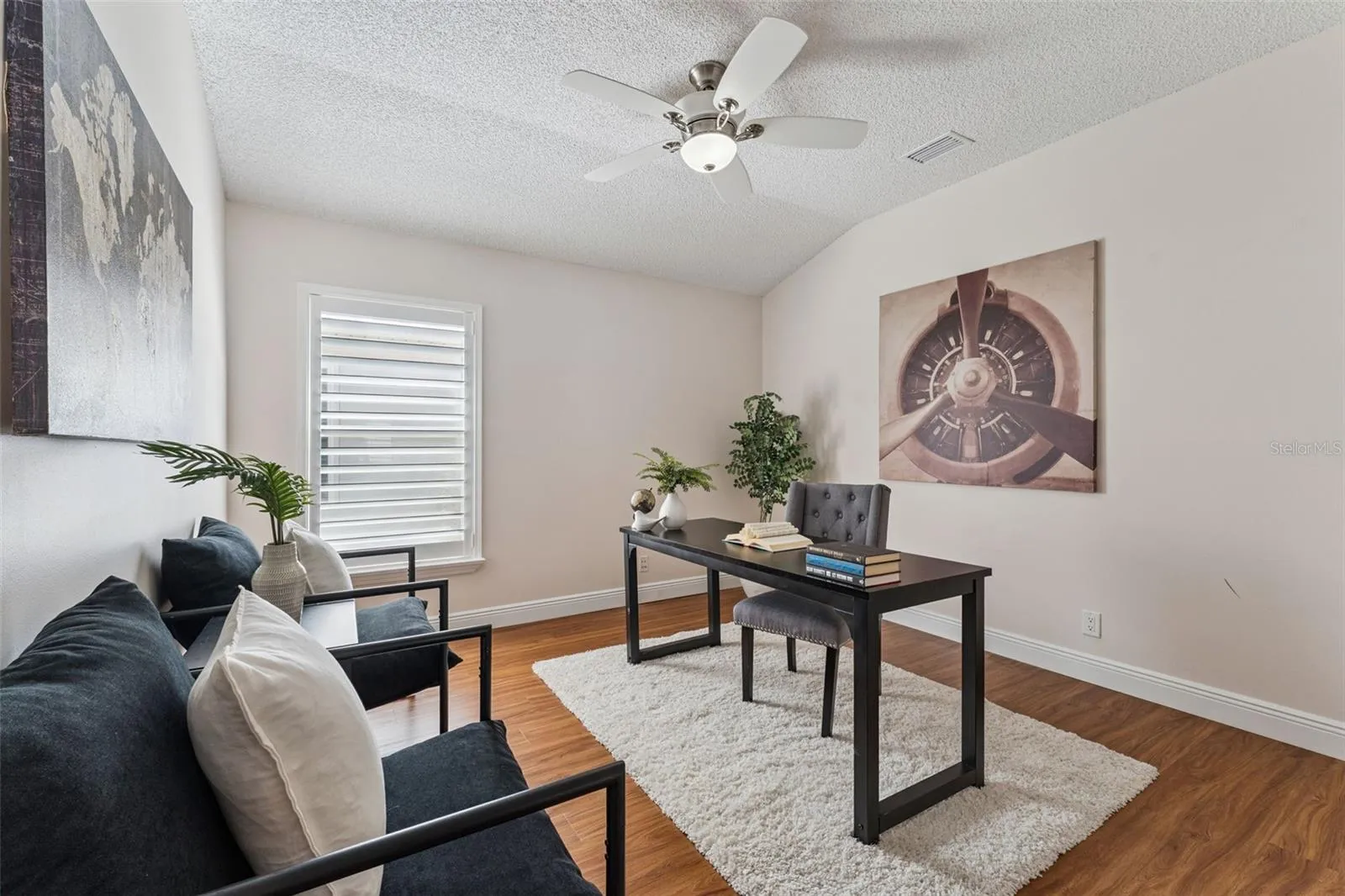 11'6" x 12' Bedroom #3 w/ Plantation style shutters &amp; a ceiling fan
