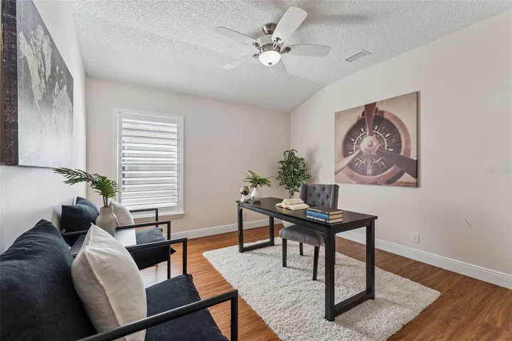 11'6" x 12' Bedroom #3 w/ Plantation style shutters &amp; a ceiling fan