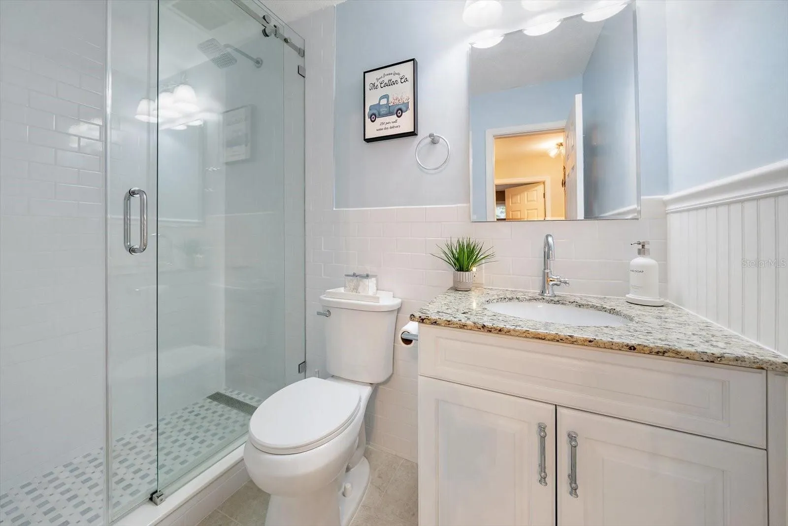 full bathroom, utilized by either the 2nd or 3rd bedroom guests