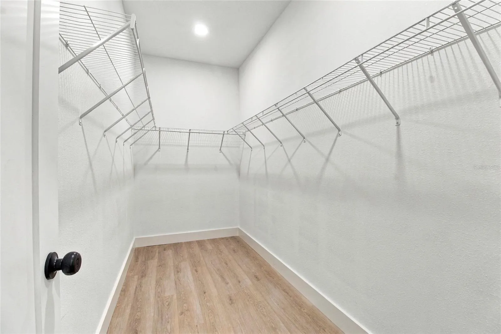 primary bedroom walk-in closet