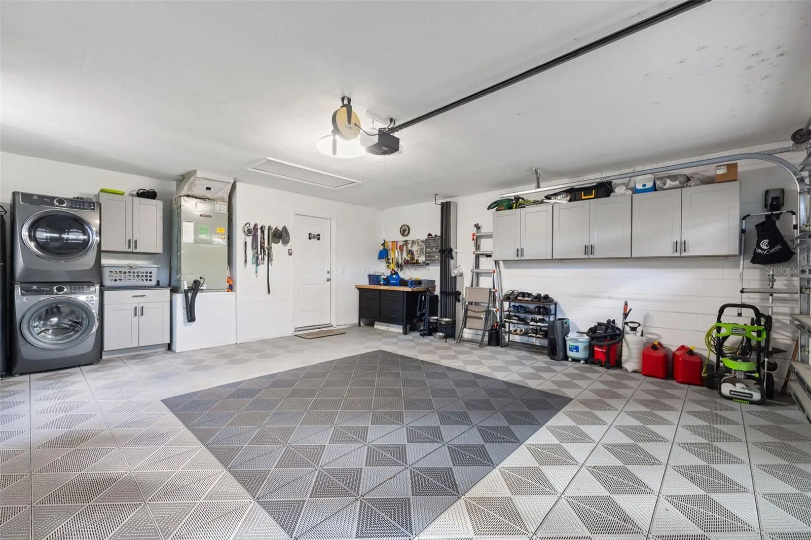 Organized 2 car garage with interlocking floor tiles
