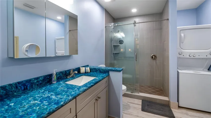 Detached garage and apartment. 2 car parking plus storage. Driveway off Lakeshore drive, little fenced in back yard. Full kitchen, laundry closet. remodeled. Pre wired for generator plug access so it can be run on a generator.