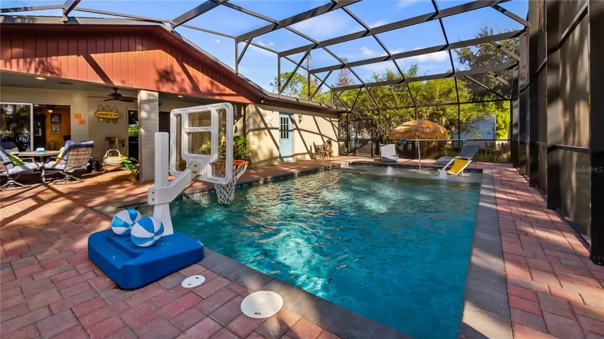 2 sets of sliders from great room to rear covered porch/pool added in 2023