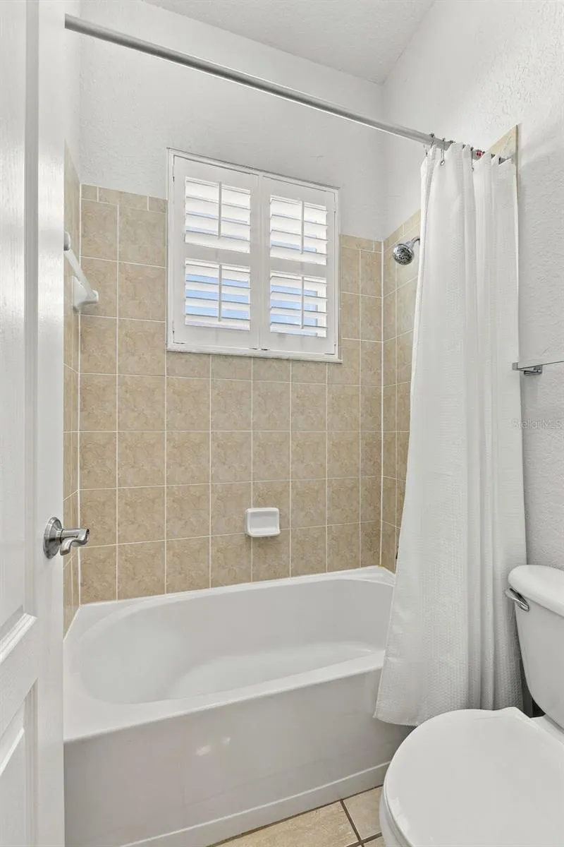 Jack N Jill Full Bathroom between Bedroom 2 and Bedroom 3. Door separates Tub and Toilet from the Sink Vanity so 2 people can use the Bathroom at the same time.